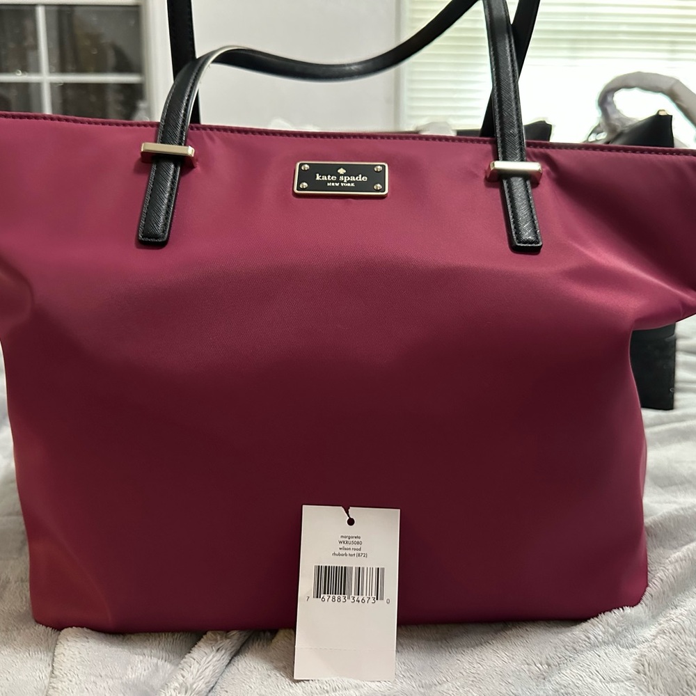 Kate Spade Pink Tote Bag with Black Handles and Spacious Design
